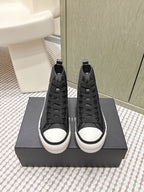 Amiri black high-top sneakers with lace-up design and white rubber toe caps
