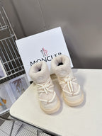 Cream fur-lined lace-up sneakers with white rope laces and cushioned collar