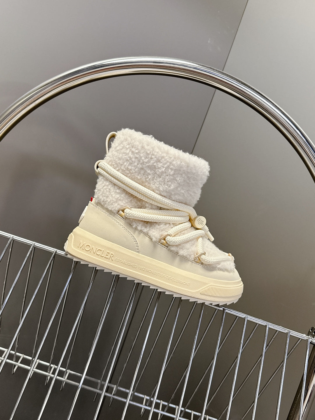 Cream fur-cuffed lace-up sneakers with white laces and rubber sole