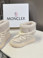 Cream fur-lined high-top sneakers with white laces and side logo patch