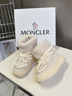 Cream sherpa-lined lace-up sneakers with white laces and chunky sole