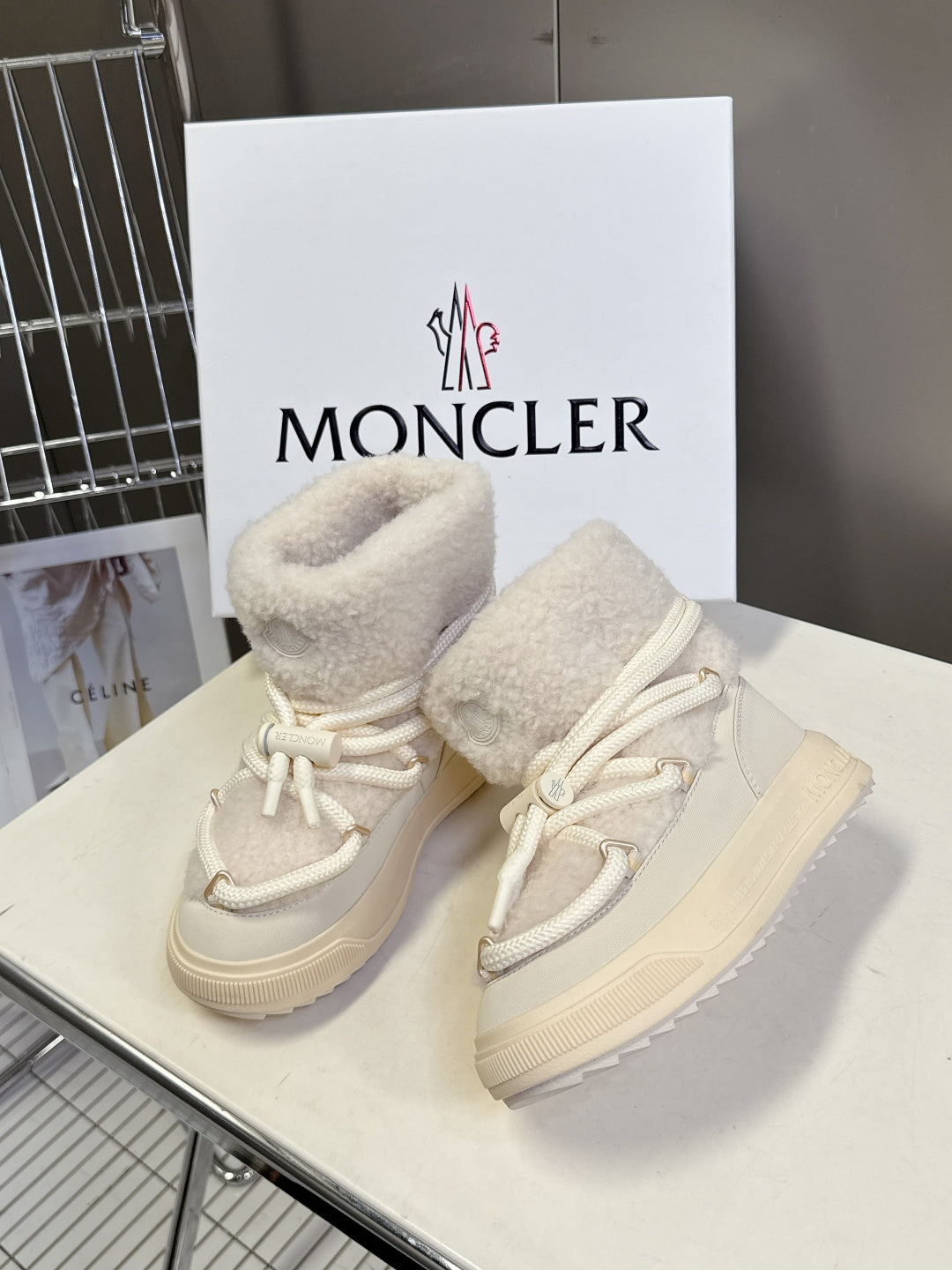Cream sherpa-lined lace-up sneakers with white laces and chunky sole