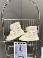 Cream high-top lace-up shoes with sherpa lining and white rope laces, side view