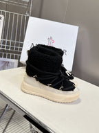 Moncler luxury shoes: black sherpa lined boots with laces and cream platform sole