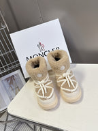 Beige shearling lace-up high-top boots with white laces and thick rubber sole