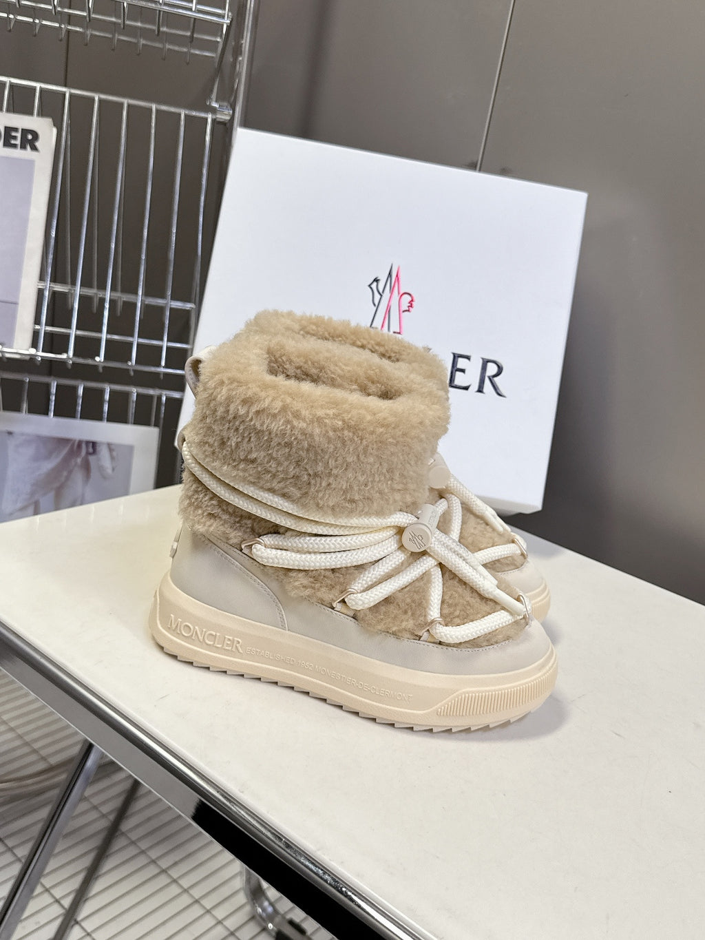 Beige shearling lace-up sneaker boots with white drawstring laces