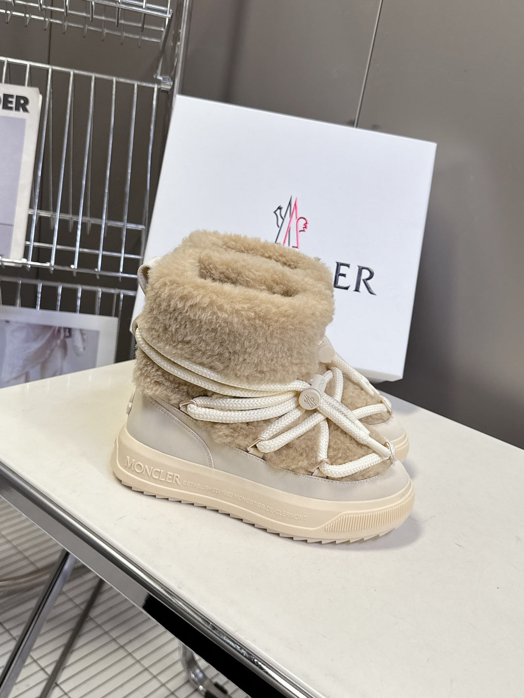 Beige shearling lace-up sneaker boots with white drawstring laces