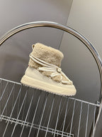 Beige shearling lace-up boot with white laces and platform-style sole