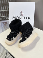 Moncler luxury shoes: black sherpa lace-up boots with cream platform, front view