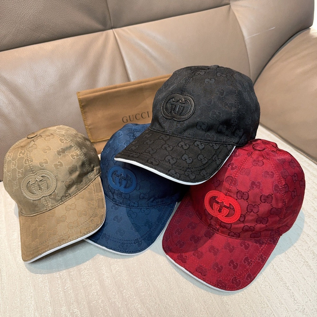 Gucci caps stack: black, navy blue, and red GG monogram styles with front logo emblems