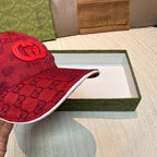 Red GG monogram baseball cap with front double-G patch and white underside brim edge.