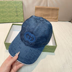 Gucci cap in navy blue GG canvas with curved brim and front logo emblem
