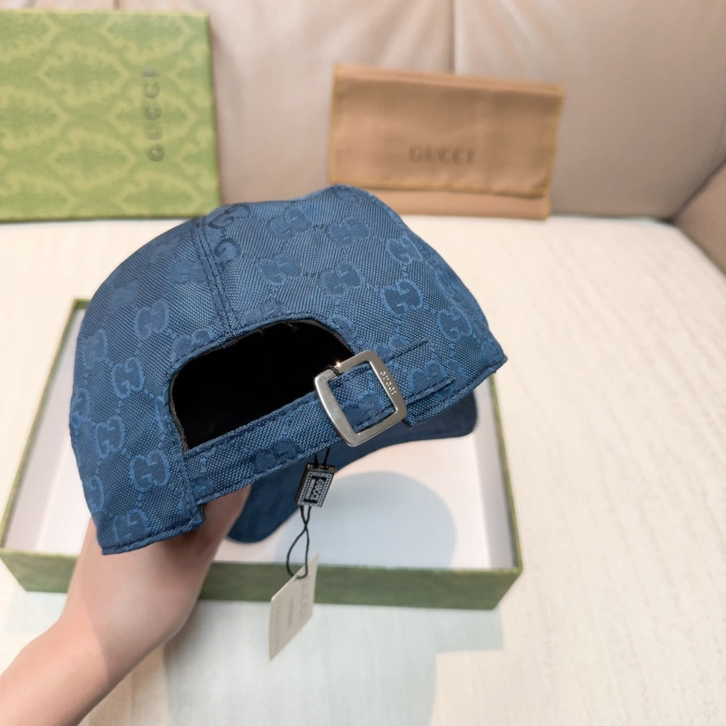 Gucci navy blue cap with adjustable buckle strap on the back closure