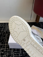 White sneaker outsole of Dior low-top, tread pattern and size marking visible