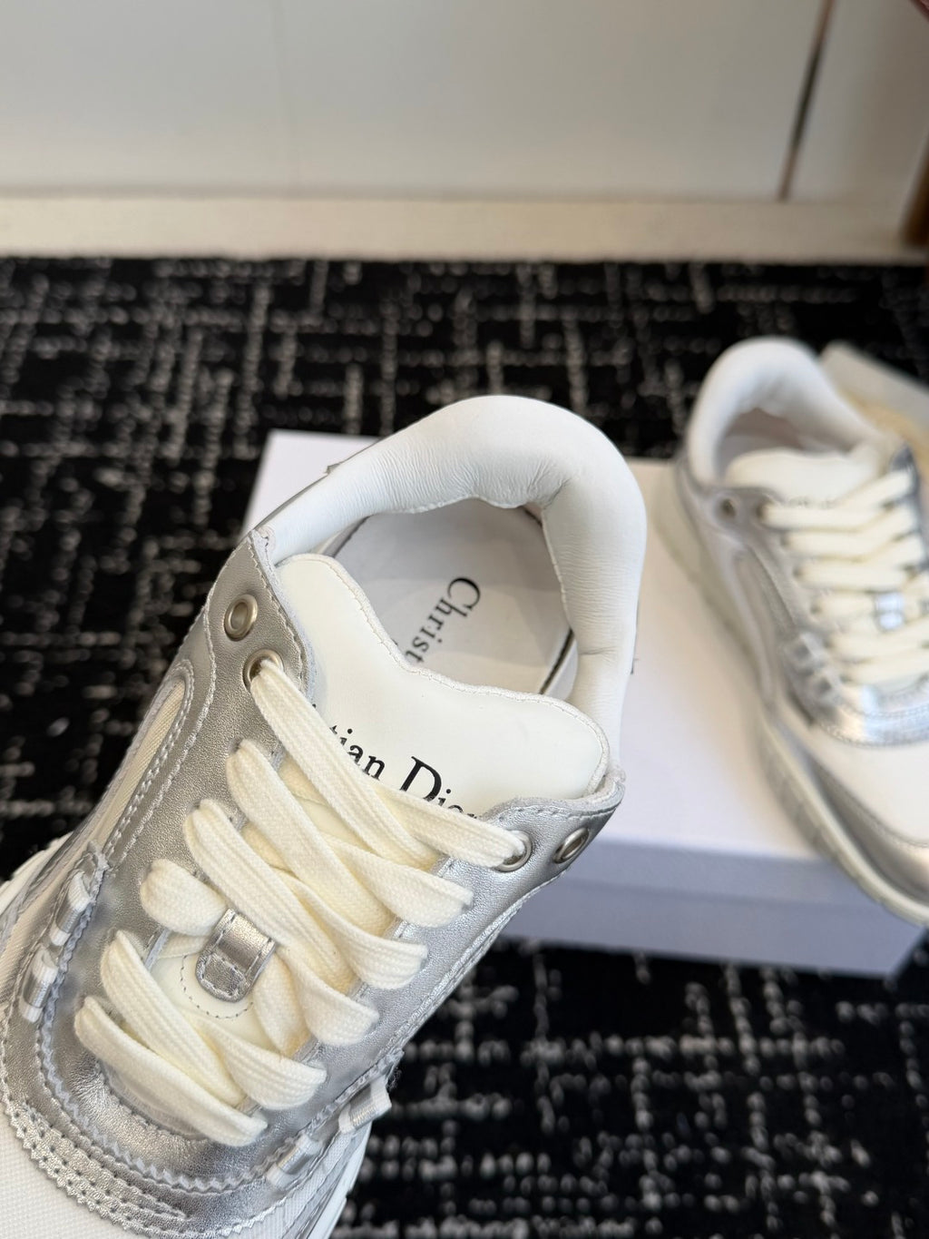 White Dior low-top sneakers, close-up of laces and interior text