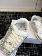 White Dior low-top sneakers, close-up of laces and interior text