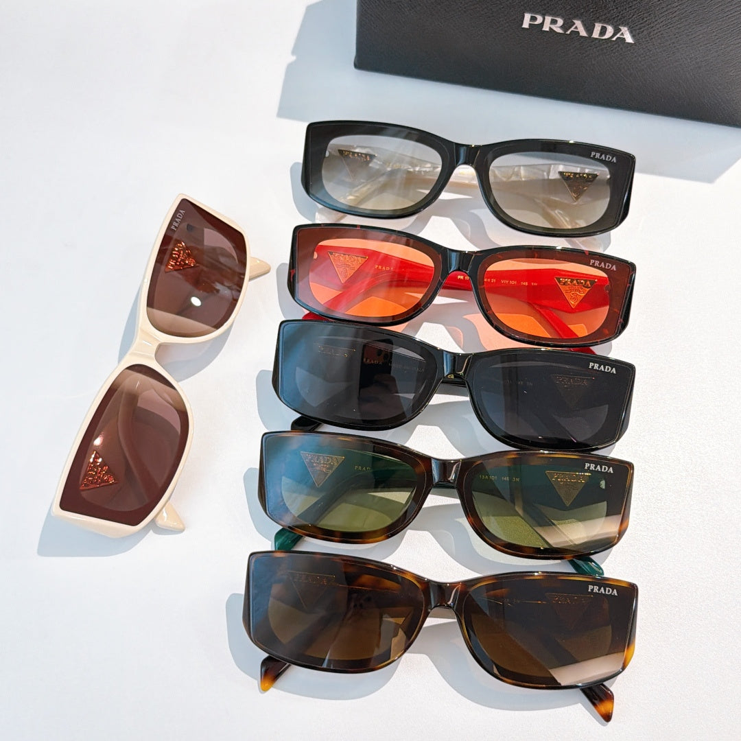 Assorted sunglasses with mixed frames and tinted lenses, gold triangle logos on temples.