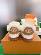 Unisex tan sneakers from back: fluffy fur collars and white soles with LV logo