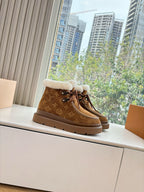 Louis Vuitton lace-up ankle boots, brown monogram with white shearling collar.