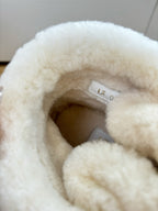 Louis Vuitton unisex shearling-lined interior of tan lace-up boot, soft fuzzy trim