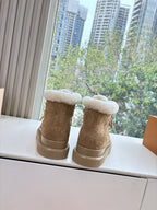 Louis Vuitton unisex lace-up boots in tan suede with fluffy shearling cuffs