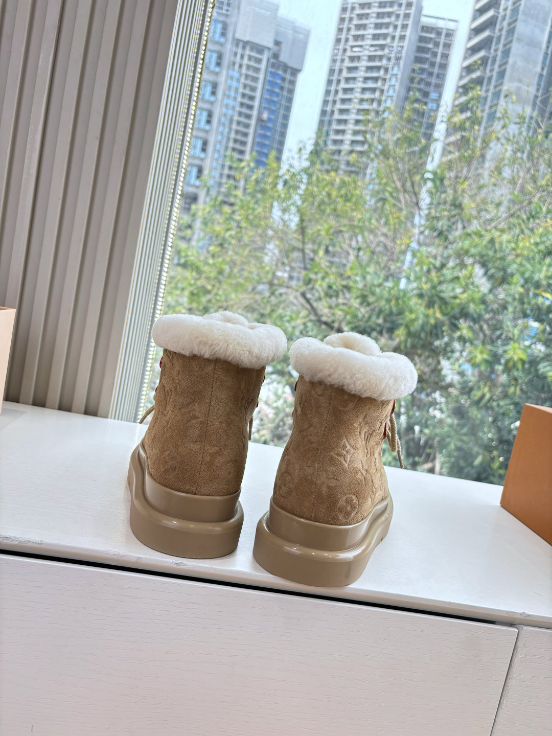 Louis Vuitton unisex lace-up boots in tan suede with fluffy shearling cuffs
