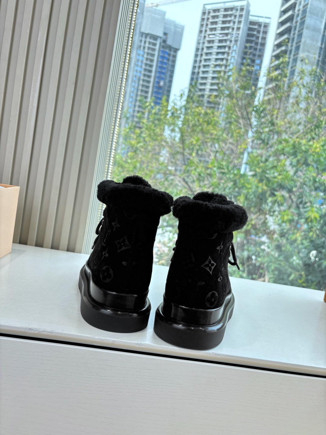 Louis Vuitton unisex black ankle boots with faux fur cuffs and chunky rubber soles