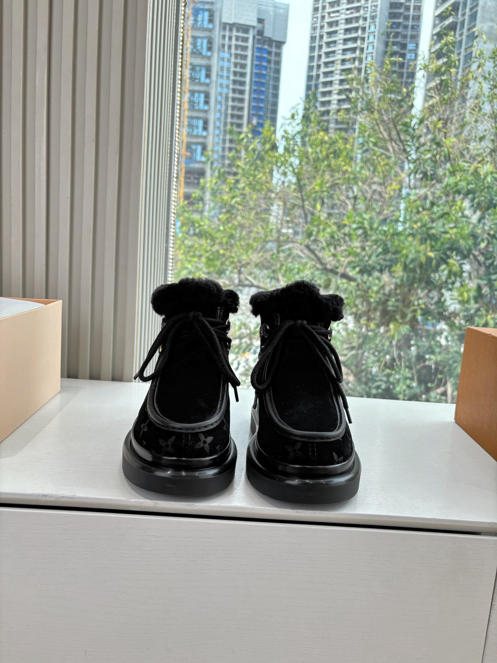 Unisex Louis Vuitton black monogram ankle boots with faux fur cuff and lace-up ties