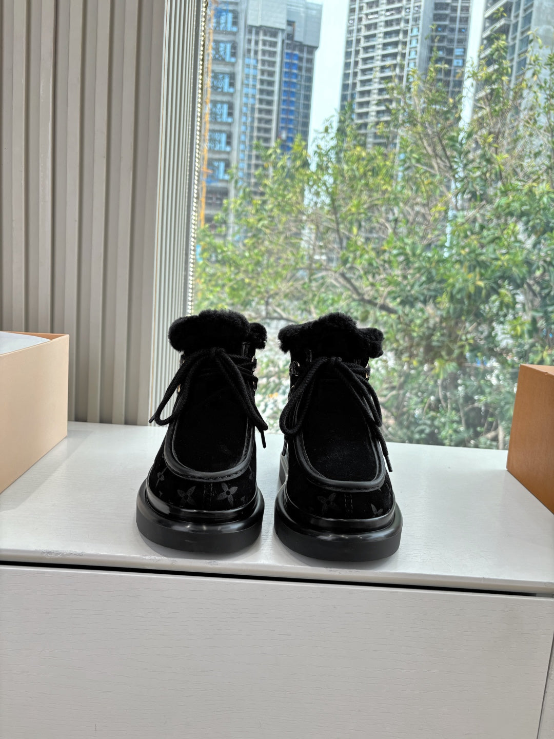 Unisex Louis Vuitton black monogram ankle boots with faux fur cuff and lace-up ties