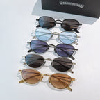 Assorted sunglasses with blue, purple, black, and brown tinted lenses, stacked set.