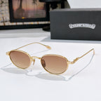 Round sunglasses with brown lenses and gold metal frame, decorative temple arms.