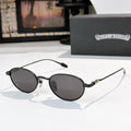 Round sunglasses with dark lenses and black metal frame, slim arms.