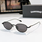 Round sunglasses with dark lenses and black metal frame, slim arms.