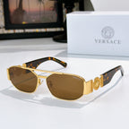 Gold Versace sunglasses with brown lenses, tortoise detail on temples