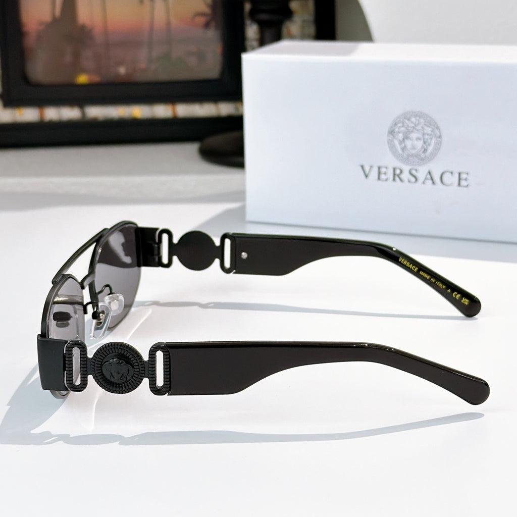 Black Versace sunglasses side view with round logo detail on temples