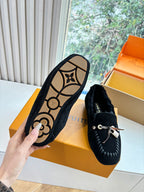 Black suede loafer outsole with LV monogram design