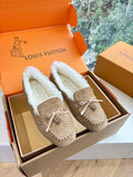 Unisex taupe suede loafers with white shearling lining and bow-tie detail