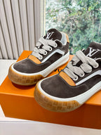 Two brown and white low-top sneakers with LV-style side logo, lace-up design, gum soles.