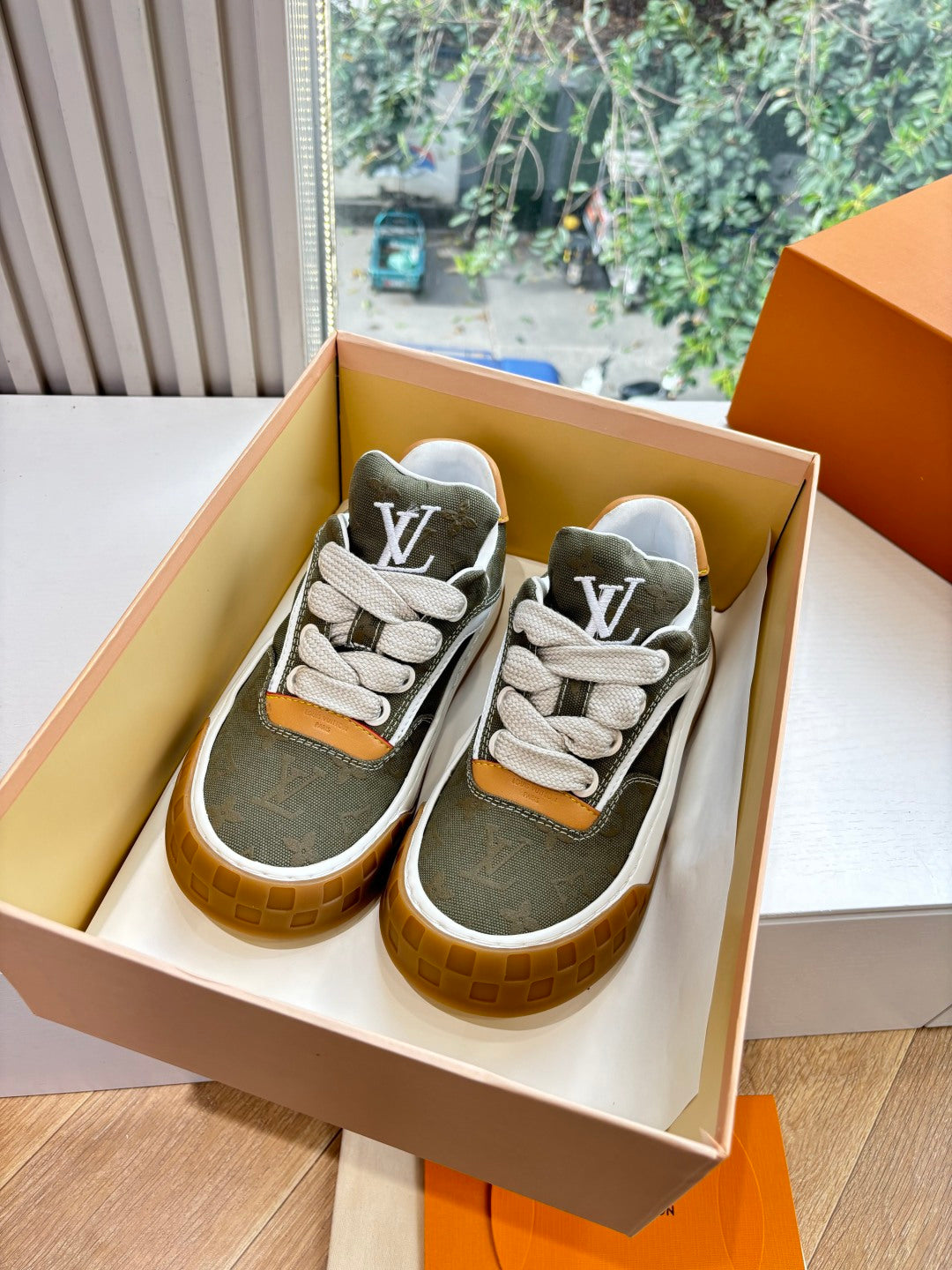 Louis Vuitton sneakers, dark olive with white laces, white sole and orange heel trim