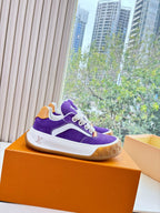 Purple Louis Vuitton low-top sneakers with white midsole, gum sole, white lace-up