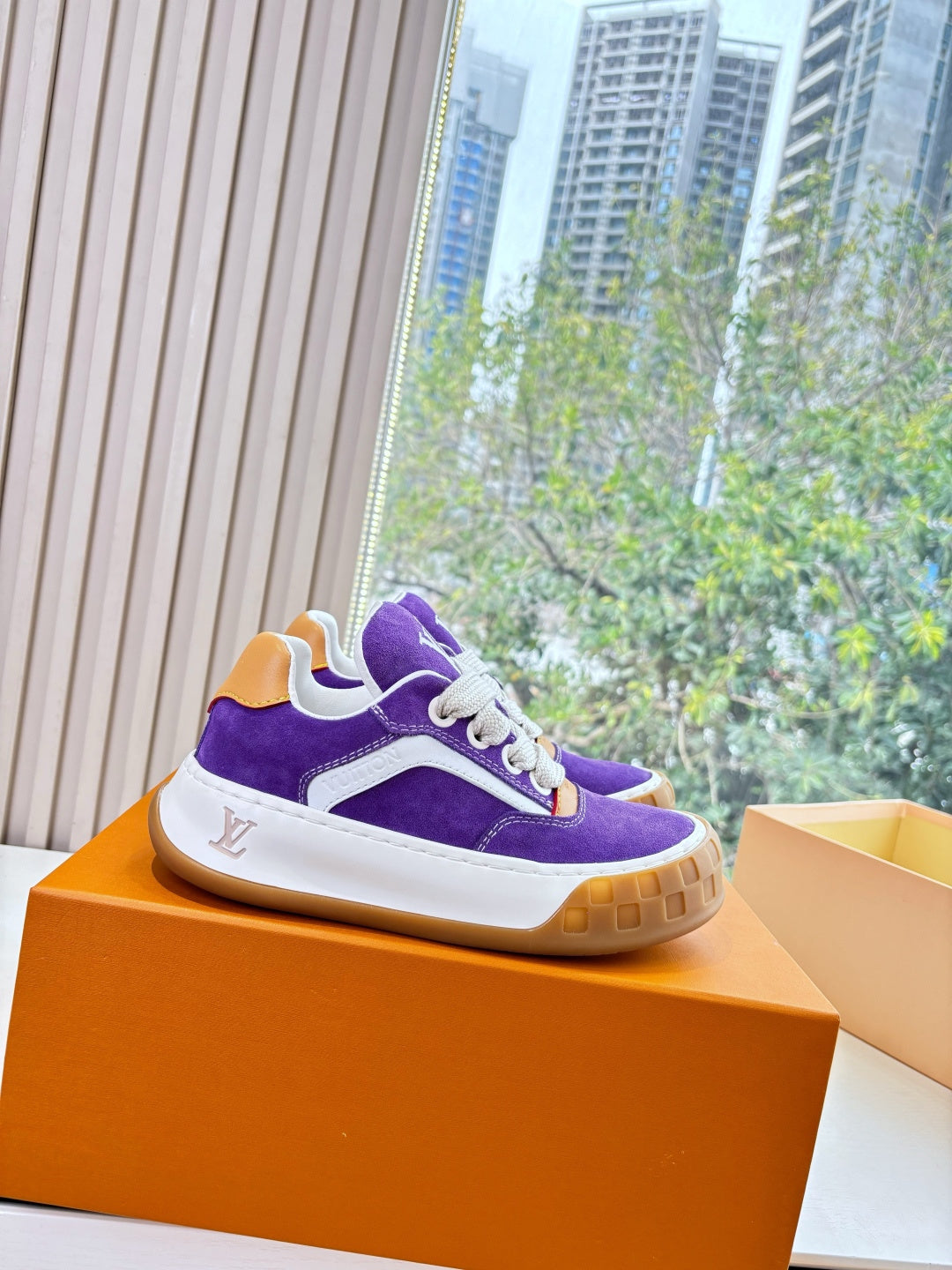 Purple Louis Vuitton low-top sneakers with white midsole, gum sole, white lace-up
