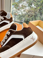 Brown and white low-top sneakers with LV logo and contrast stitching detail