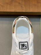 Burberry white sneaker tongue with logo patch and check-pattern collar lining