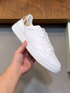 White leather lace-up sneaker with rubber sole and Burberry logo on tongue