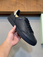 Black leather low-top lace-up sneaker with padded collar