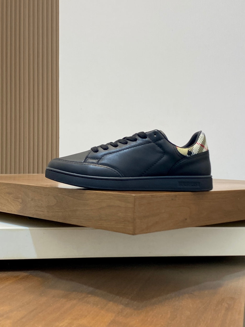 Dark blue low-top lace-up sneakers with rubber sole