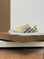 Burberry check low-top sneakers, side view, beige plaid upper with lace-up