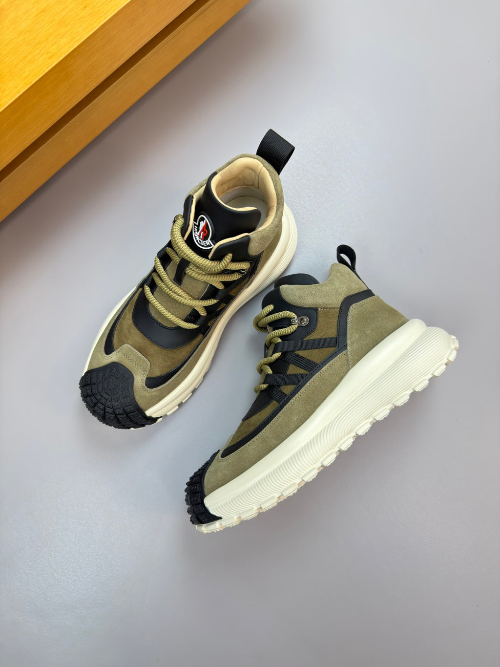 Moncler sneakers side view: olive and black upper with neon-yellow lace trim