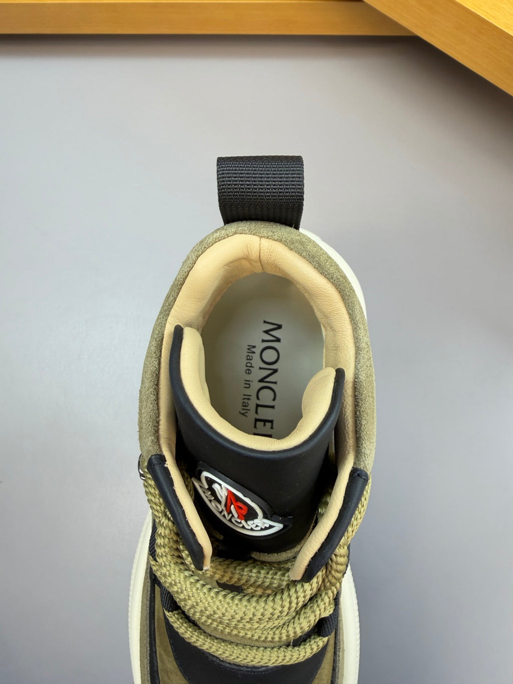 Moncler sneaker heel close-up with interior label reading MONCLER