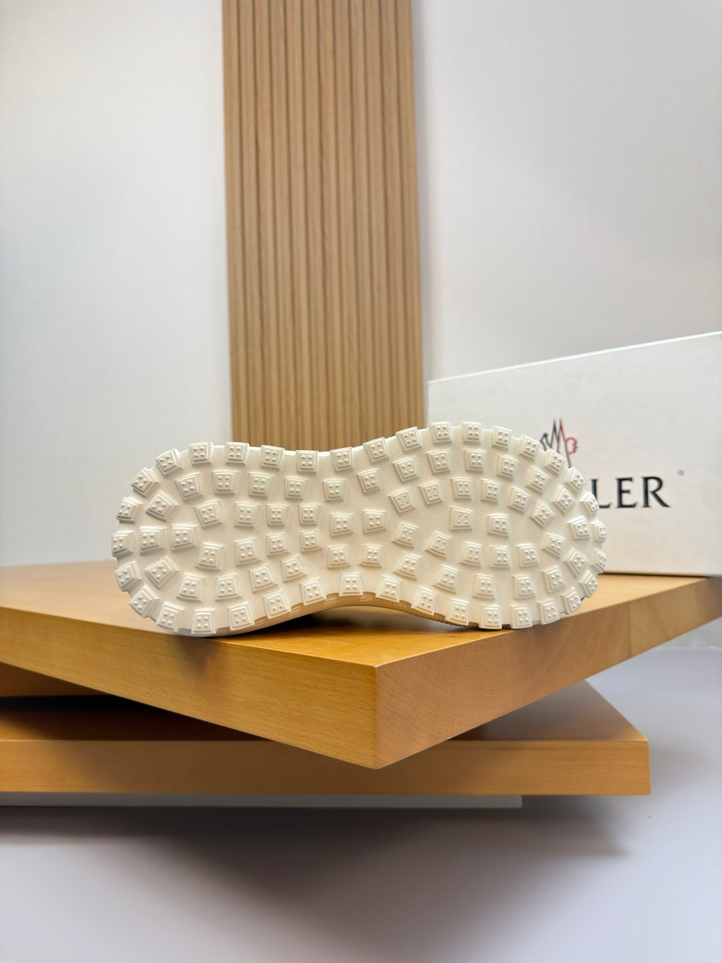 Moncler sneakers outsole view with white textured rubber tread pattern